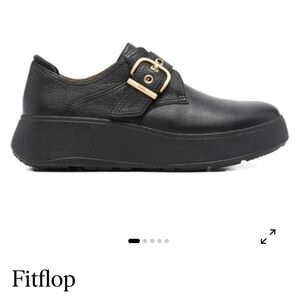 Woman  Black Leather Slip-On Loafers with Gold Buckle Accent